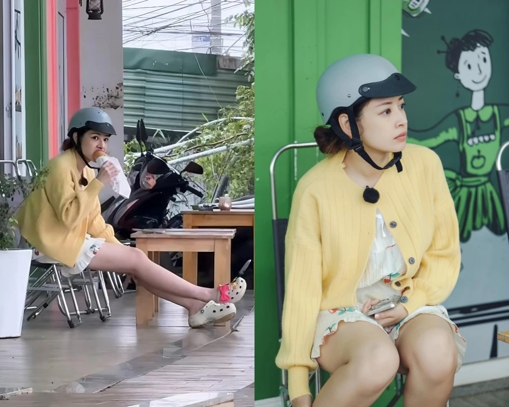 Chi Pu mặc đồ ngủ, đội mũ bảo hiểm gặm bánh mì lề đường