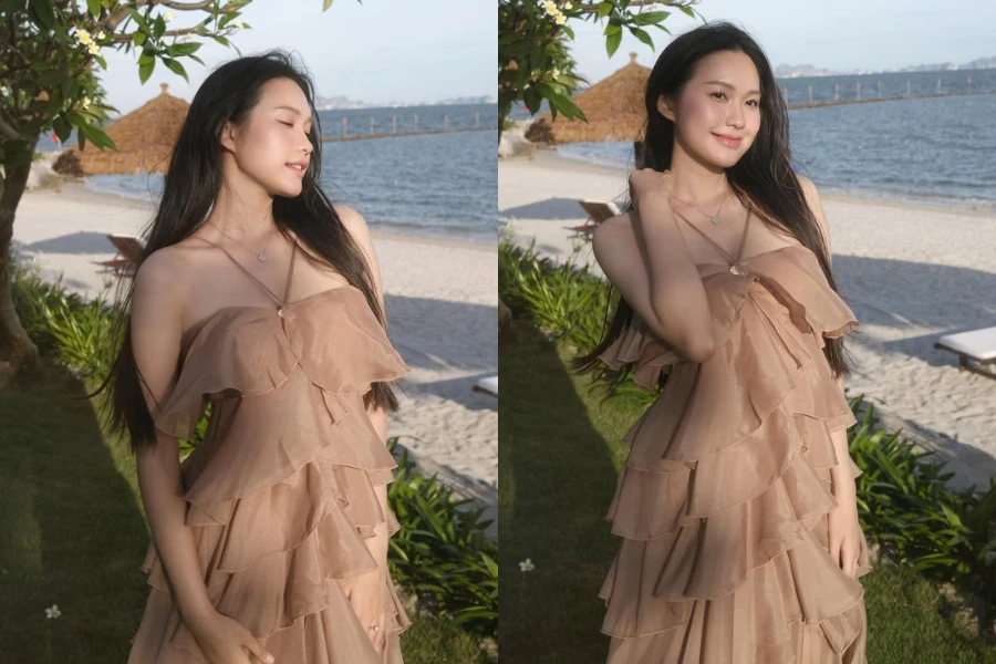 Doãn Hải My đẹp dịu dàng, e ấp khoe vai trần bên bờ biển