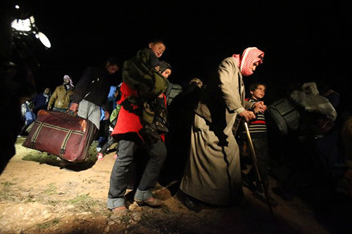 Ngày 18/2/2013 – Người tị nạn chạy trốn khỏi cuộc xung đột Syria tới biên giới Jordan. Hàng nghìn người đã bỏ chạy khỏi cuộc xung đột ở Syria và ồ ạt tới trại tị nạn Zaatari.