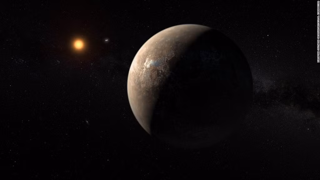 Proxima B quay quanh ngôi sao gần nhất mang tên Proxima Centauri, ngôi sao lùn đỏ chỉ cách 4 năm ánh sáng.Proxima B ở khoảng cách đủ gần so với Proxima Centauri để nước không bị đóng băng hay đun sôi. Các nhà khoa học đang tìm cách đưa tàu thăm dò không người lái lên hành tinh này để xem có tồn tại sinh vật ngoài hành tinh trên đó hay không. Tuy nhiên, nhiệm vụ này có thể kéo dài qua nhiều thế hệ. Ảnh:ESO.