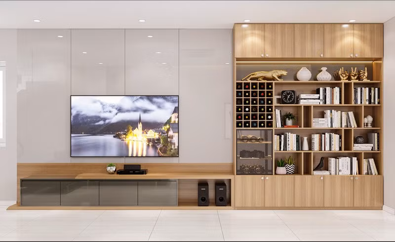 Kệ tivi kết hợp với giá sách và kệ rượu, nhằm tiết kiệm diện tích.