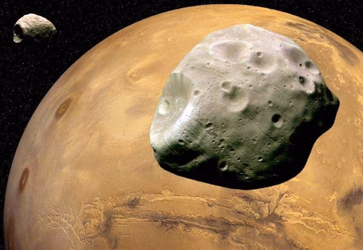  Hai mặt trăng nhỏ: Sao Hỏa có hai mặt trăng, Phobos và Deimos, được cho là các tiểu hành tinh bị bắt vào quỹ đạo của nó. Ảnh: Pinterest.