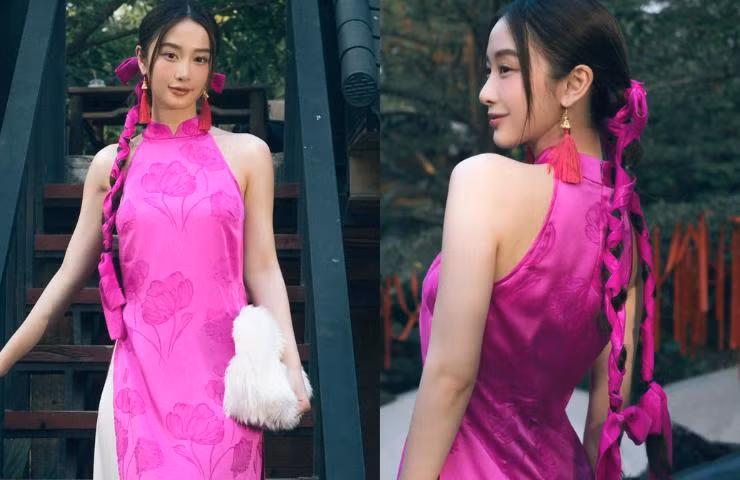 Cô hoàn thiện vẻ ngoài của mình bằng cách make up nhẹ nhàng, kiểu tóc búi cao gọn gàng.