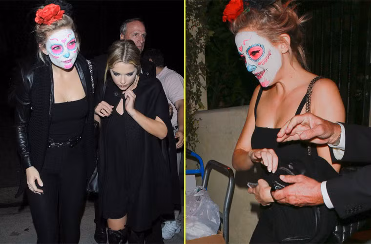 Kate Hudson đeo mặt nạ người chết kiểu Mexico cùng một người bạn tới dự Halloween sớm tại nhà Mike Meldman.