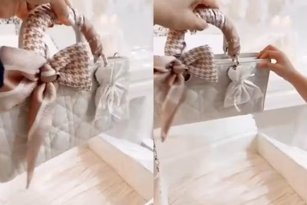 Món quà mà nam danh hài tặng vợ là một chiếc túi Dior được thắt khăn cẩn thận với phiên bản màu trắng, cũng là gam màu Nhã Phương ưa chuộng.