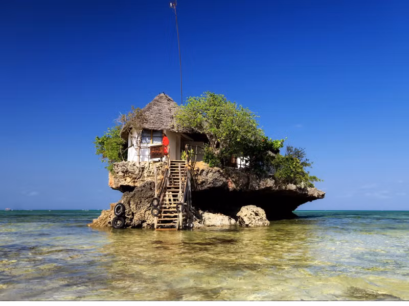 The Rock (Zanzibar). Nhà hàng tương đối trẻ khi mới được khánh thành năm 2010. The Rock nằm trên một tảng đá lớn của đảo Zanzibar. Đối với khách hàng, đến với The Rock không chỉ để ăn những món ngon mà còn để trải nghiệm hành trình thú vị.