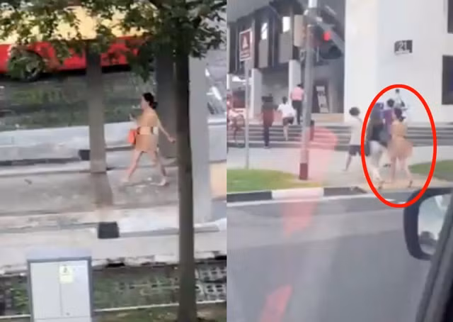 Nguoi phu nu ngong nghenh di bo tren pho gay choang