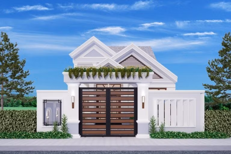 Mẫu nhà mái thái 1 tầng này nổi bật với gam màu trắng. Cổng, cửa chính, cửa sổ sử dụng gỗ tự nhiên sang trọng và kiên cố. Cây xanh vừa là yếu tố trang trí tăng tính thẩm mỹ, vừa giúp không khí trong lành