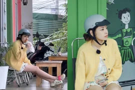 Chi Pu mặc đồ ngủ, đội mũ bảo hiểm gặm bánh mì lề đường