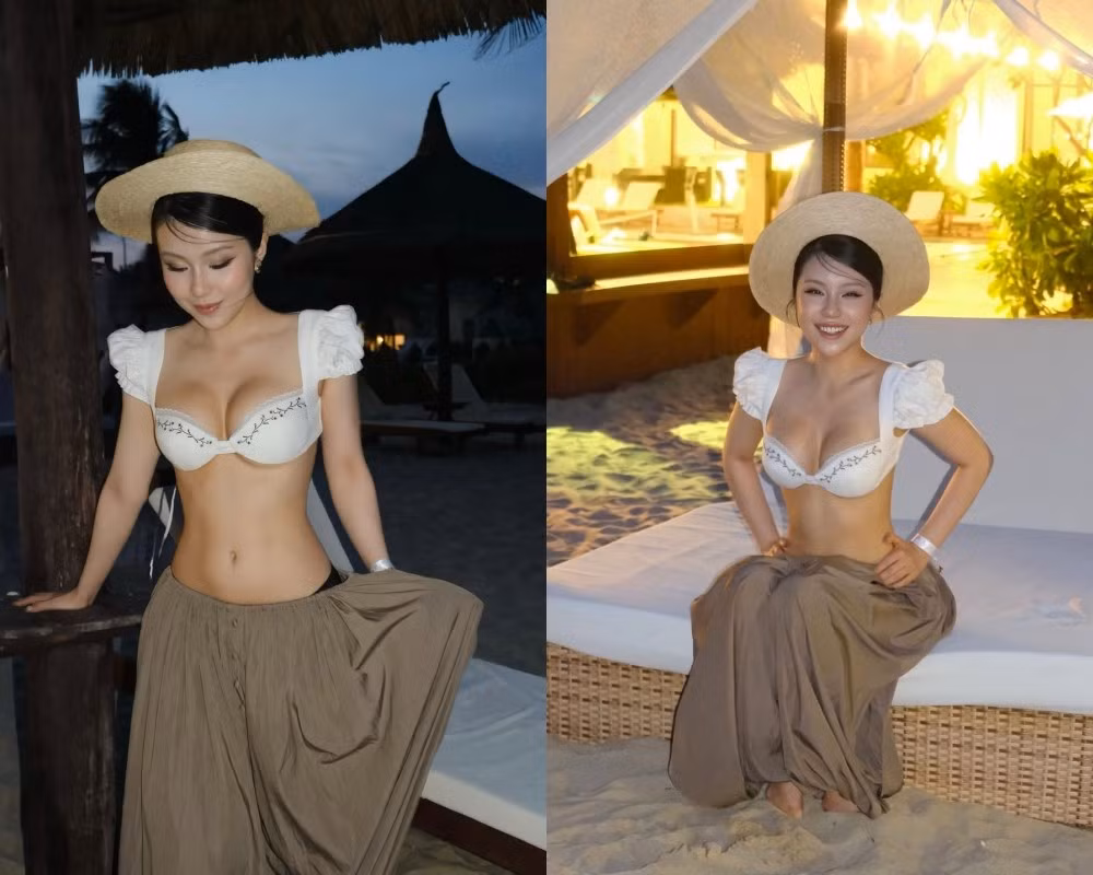 Nữ TikToker diện một thiết kế áo bra-top màu trắng, mô phỏng kiểu dáng áo "dirndl" (trang phục truyền thống của Đức) với chi tiết tay bồng đầy nữ tính và đường thêu hoa tinh tế. Thiết kế này khéo léo tôn lên vòng một đầy đặn, gợi cảm của nữ TikToker.