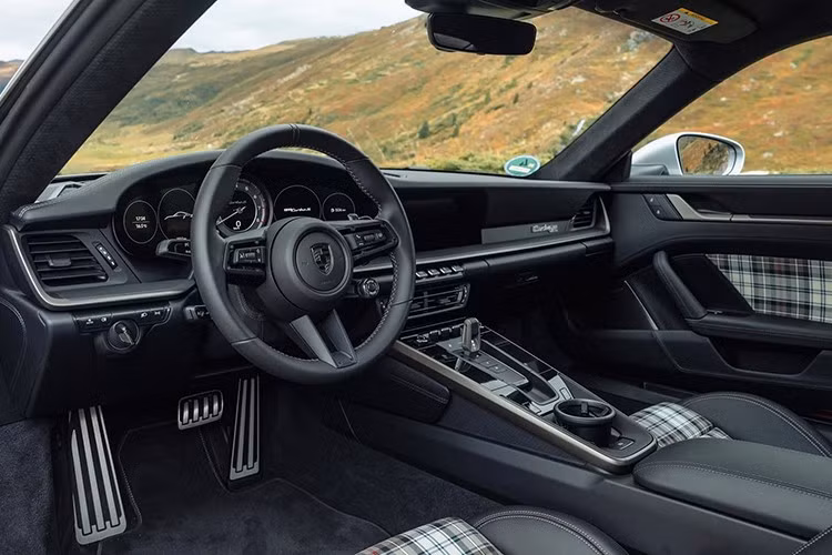 Về nội thất, khoang cabin của Porsche 911 Turbo 50 Years tái hiện phong cách hoài cổ với ghế bọc vải dệt Tartan theo họa tiết McKenzie, tương tự bản concept 911 RSR Turbo 1973. Đây là kiểu nội thất từng xuất hiện trên các phiên bản giới hạn như 911 Sport Classic hay 911 Spirit 70.