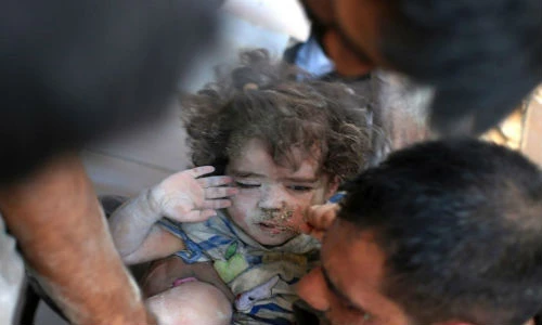 Trẻ em Syria mắc kẹt "giữa hai làn đạn"