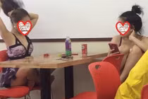 Gái trẻ ăn ngủ, ngả ngốn ở cửa hàng tiện lợi tránh nóng