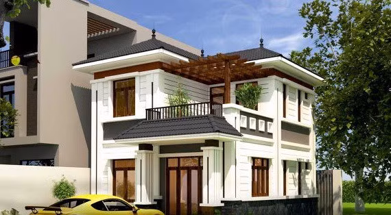 Nhà 2 tầng với các chi tiết trang trí phào chỉ mạnh mẽ, nhấn nhá bằng cách khối, các đường kẻ chỉ hài hòa. Ảnh: Thietkethicongnhadep.