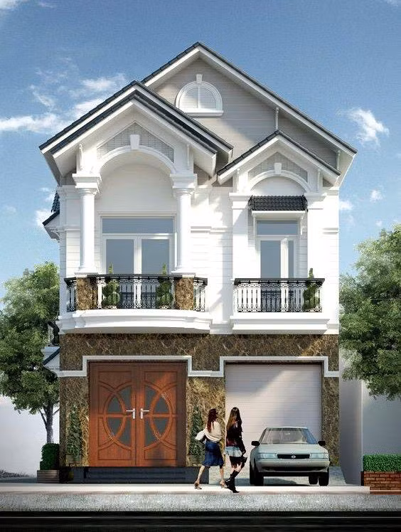 Tuy là nhà ống 2 tầng nhưng mẫu thiết kế này lại khiến người ta gợi nhớ đến các mẫu biệt thự bởi hệ thống mái phụ cùng màu sơn trắng đặc trưng.
