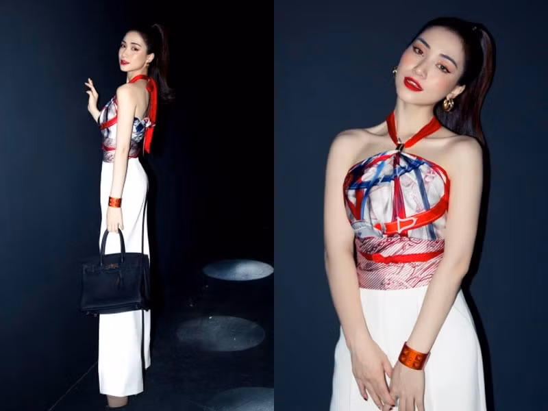 Diện chiếc áo làm từ khăn hiệu Hermes kết hợp với chiếc quần màu trắng ống rộng, Hoà Minzy vừa quyến rũ vừa sang chảnh. (Ảnh: Vietnamnet)