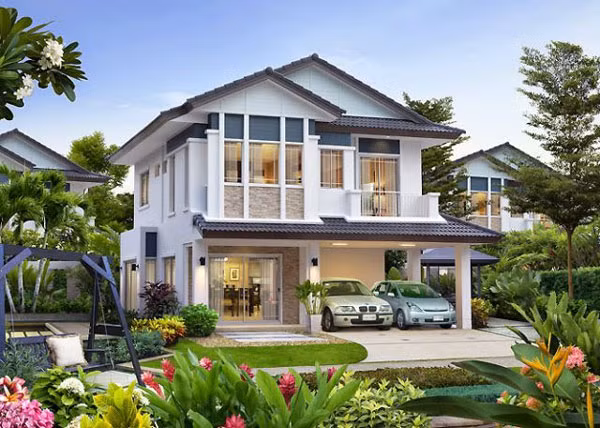 Biệt thự vườn thiết kế đơn giản nhưng tinh tế với những đường nét cứng cáp. Vườn rộng trồng nhiều cây và hoa. Ảnh: Handymandecor.