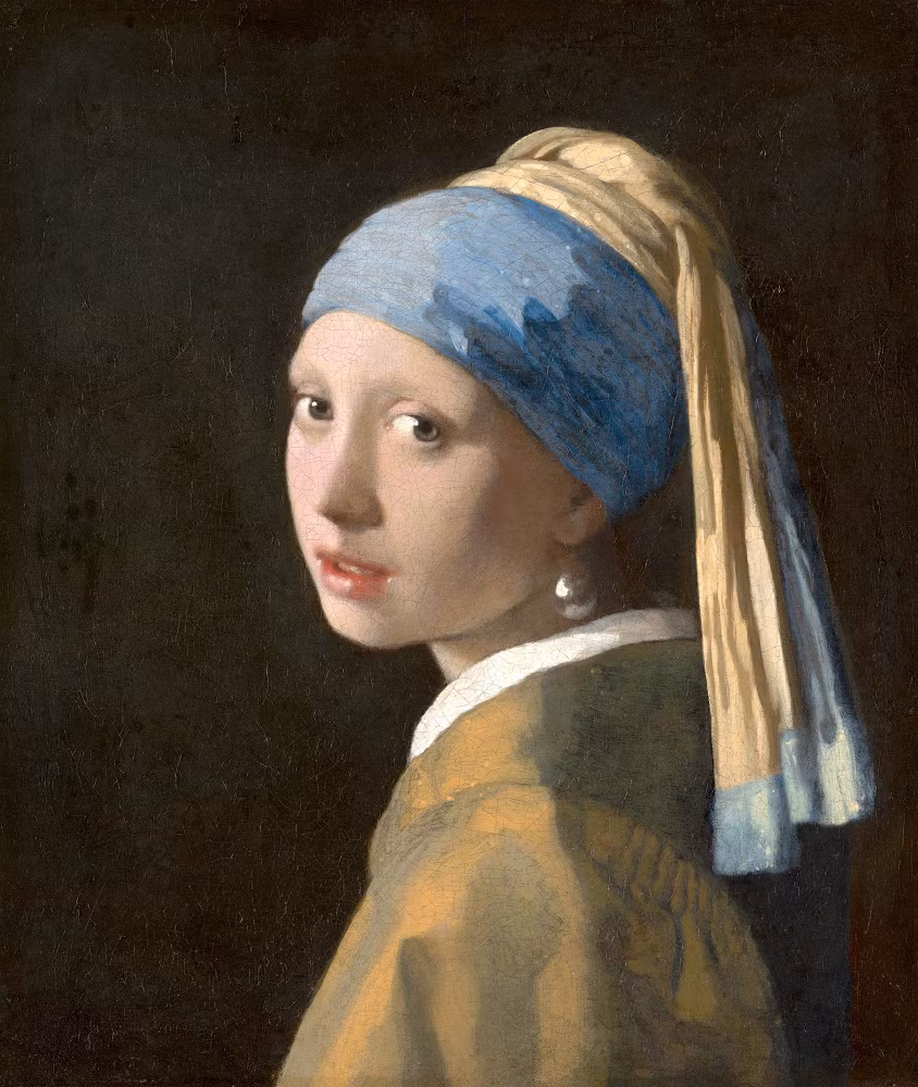 2. "Girl with a Pearl Earring" và Cô gái bí ẩn: "Girl with a Pearl Earring" của Johannes Vermeer, được vẽ vào khoảng năm 1665, là một bức chân dung quyến rũ với ánh mắt mơ màng và đôi môi hé mở. (Ảnh: Mauritshuis)