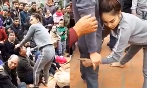 Cô gái mệnh danh là "Công chúa thuốc lào" đang chữa bệnh cho các bệnh nhân.? Ảnh cắt từ clip.