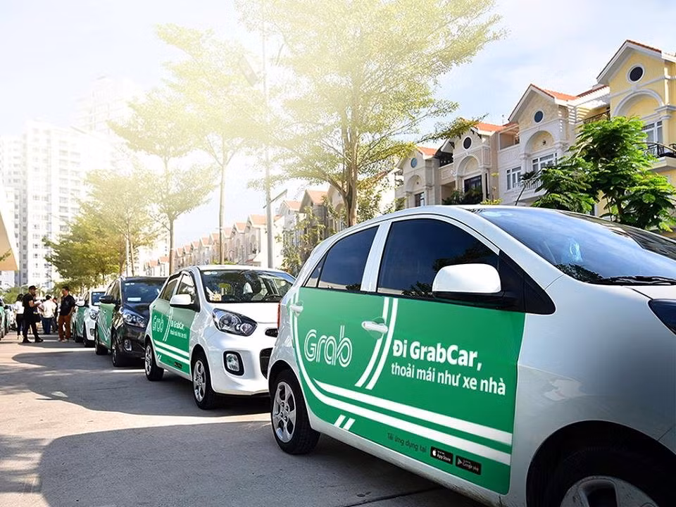 Mua lai toan bo Uber Dong Nam A, Grab co “doc quyen” tang gia?