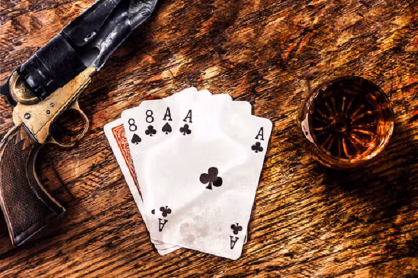 Một tay chơi bài tên là Robert Fallon đã bị cáo buộc gian lận trong một ván bài xì pé (poker) tại thành phố San Francisco vào năm 1858. Những đối thủ đã bắn chết ông. Không ai muốn ngồi vào chiếc ghế xui rủi của người đàn ông quá cố, nhưng các đối thủ đã tìm được một người đàn ông thế chỗ và đặt cược cho anh 600 USD của Fallon.