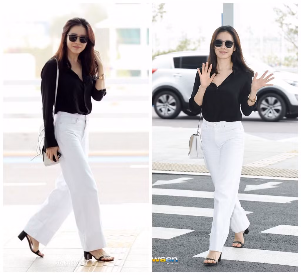 Thời trang sân bay của "chị đẹp" khá năng động với áo sơ mi đen và quần ống rộng màu tương phản.
