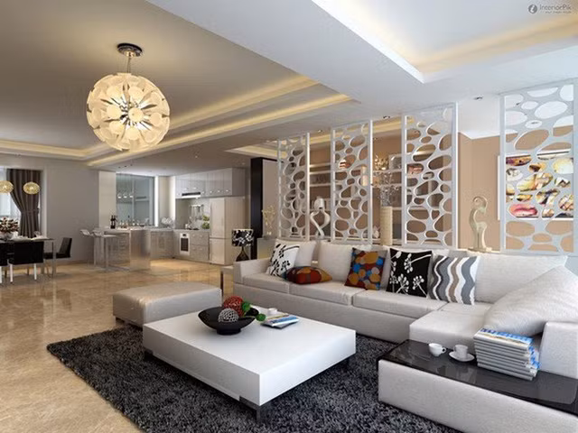 Vách ngăn kết hợp với tủ để đồ tạo thành chỗ dựa cho sofa và tạo ra lối lưu thông trong nhà.