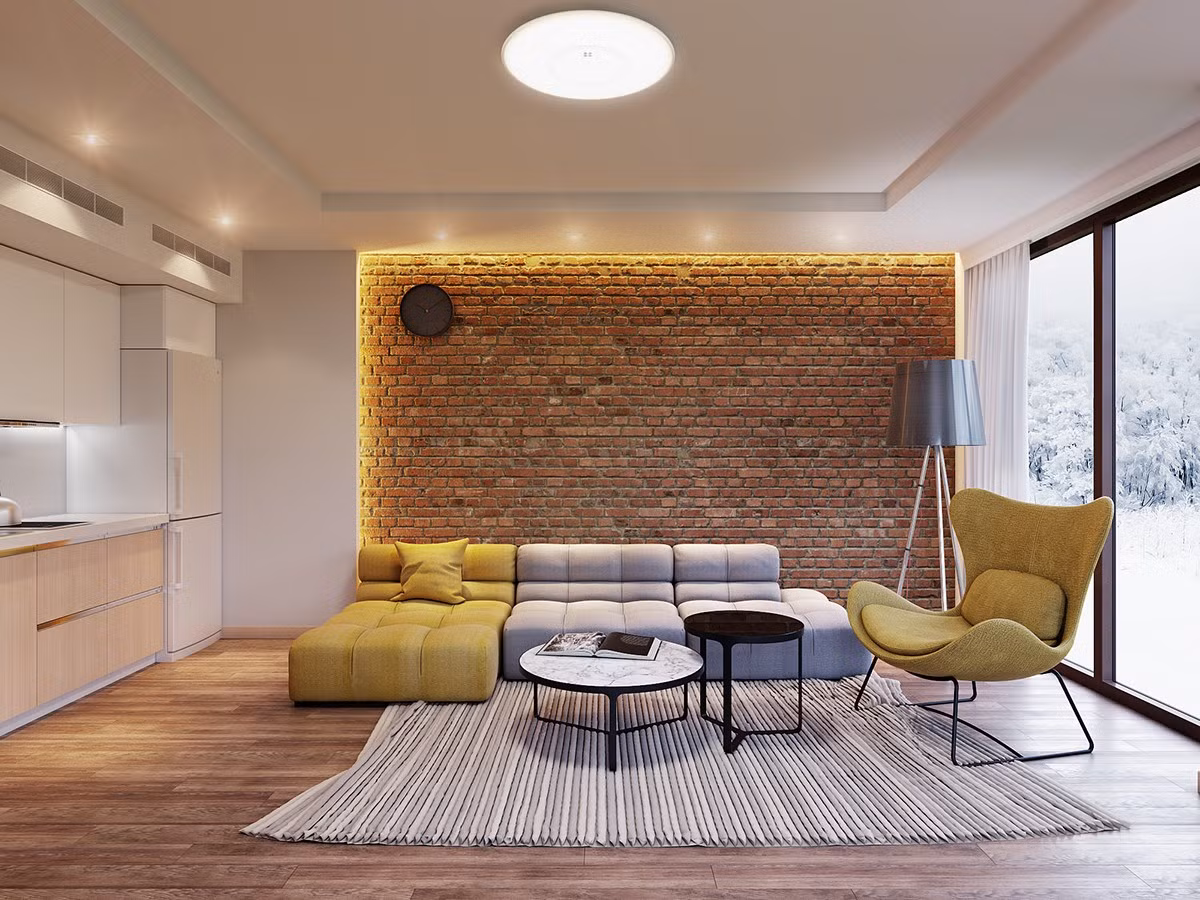 Một bức tường gạch cổ điển tạo điểm nhấn độc đáo trong không gian phòng khách hiện đại.