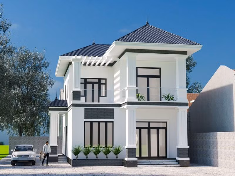Nhà vuông 2 tầng mái Nhật nổi bật với vẻ đẹp khỏe khoắn, hiện đại. Khối mái đua rộng và thiết kế ban công thông thoáng tạo sự bề thế. Ảnh: Angcovat