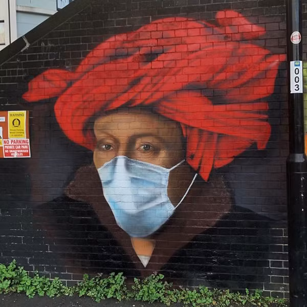 Hình ảnh một người phụ nữ đeo khẩu trang được nghệ sĩ đường phố Lionel Stanhope vẽ tại London, Anh.