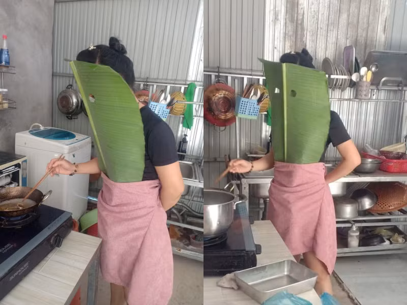 Không chỉ bảo hộ vùng trên cơ thể, người phụ nữ này còn lấy khăn quấn chân để tránh dầu nóng bắn vào.