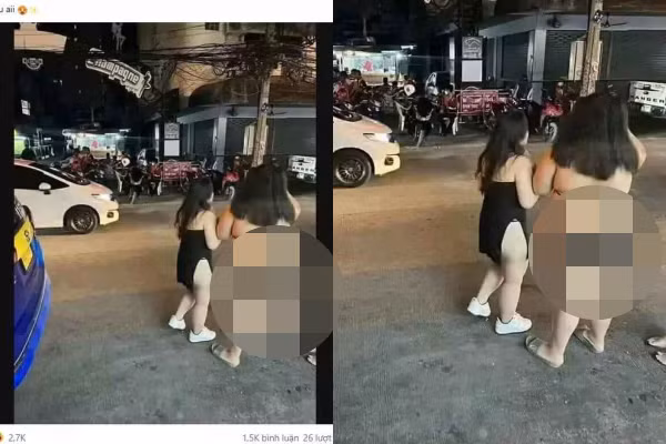 Người bạn đi cùng có phần thon thả, kín đáo hơn trong chiếc váy quây ngực nhưng xẻ tả tới tận eo, để lộ rõ một bên hông.