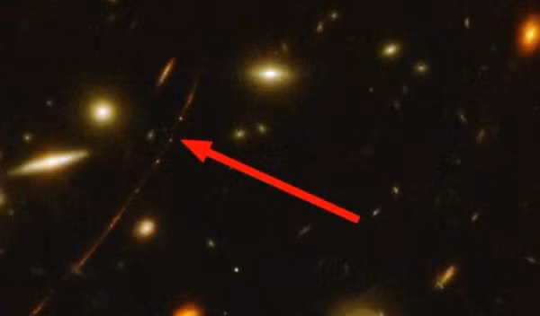 Hai siêu kính viễn vọng không gian là James Webb và Hubble đã phát hiện một ngôi sao lớn màu xanh lam, ra đời gần 13 tỉ năm trước hiện ra dưới dạng một " bóng ma".