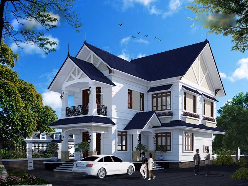 Nhà 2 tầng chữ L sử dụng mái thái xanh lạ mắt và sang trọng. Ảnh: Wedo.