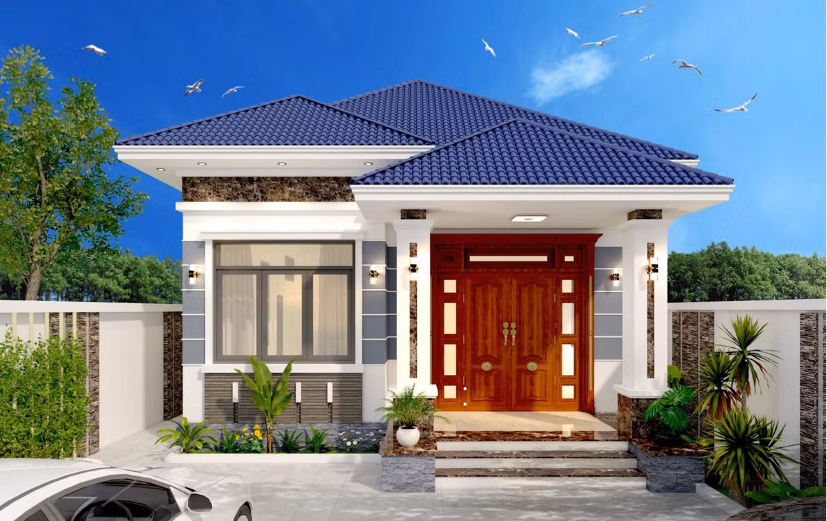 Nhà 1 tầng mái Nhật được thiết kế trên nền tông trắng chủ đạo của tường và mái xanh đẹp mắt. Cột vuông mang lại sự khỏe khoắn cho công trình. Ảnh: Wedo