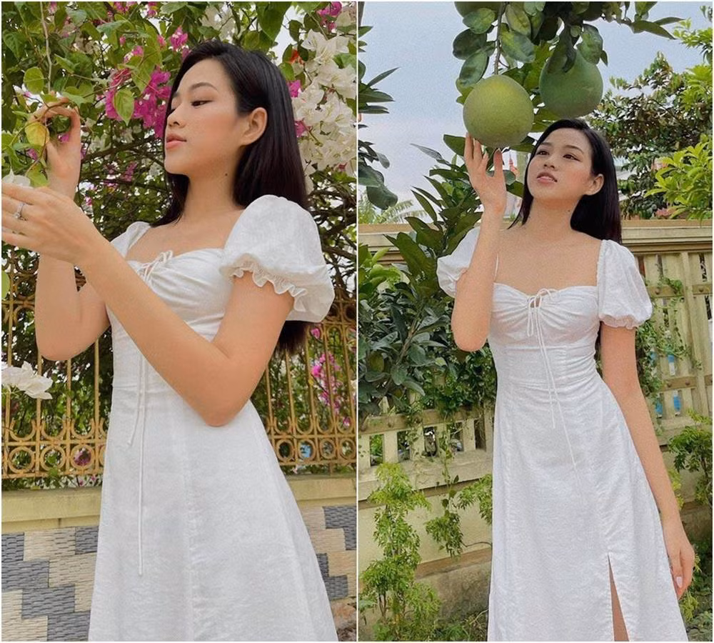 Không cần trưng trổ túi hiệu, Hoa hậu chỉ cần diện duy nhất một chiếc váy trắng tay bồng với thiết kế dúm ở ngực là đã toát lên vẻ dịu dàng vốn có, cũng như khoe khéo được đường cong cơ thể.
