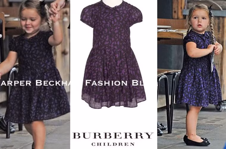 Cô bé lại được mẹ diện cho một chiếc váy hoa của Burberry đi dạo phố.