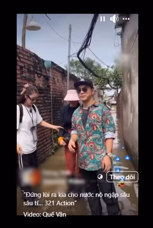Vợ chồng Ưng Hoàng Phúc - Kim Cương và Quế Vân đang trở thành tâm điểm khi đi trao quà cho bà con ở Phúc Tân (Hoàn Kiếm, Hà Nội). Điều khiến cư dân mạng bàn tán là việc bộ ba lựa chọn góc quay, bị nghi diễn. Ảnh: FB Quế Vân.