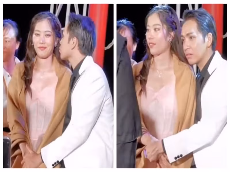 Bạch Công Khanh nắm tay, hôn gió Nam Em. Ảnh: Công lý và xã hội