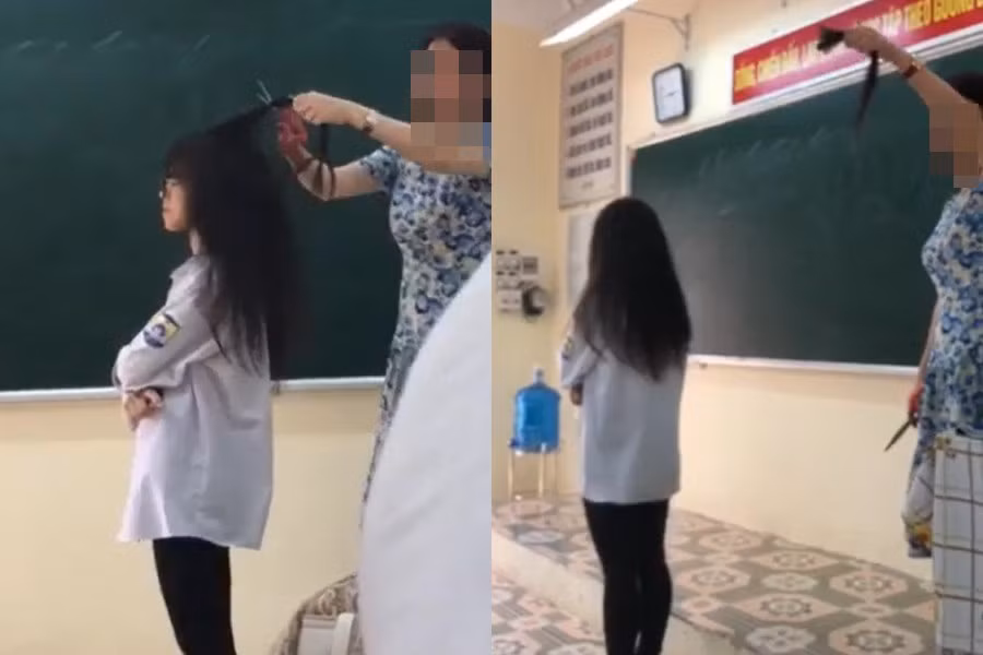Sau khi cắt một lọn tóc của nữ sinh này, cô tiếp tục tuyên bố: “Hôm nay tôi cảnh cáo… Lần sau những ai như thế này, tôi sẽ cắt thật nhiều, chứ không phải chỉ mỗi vậy. Tôi công khai trước lớp như thế”. Ảnh: Cắt ra từ clip