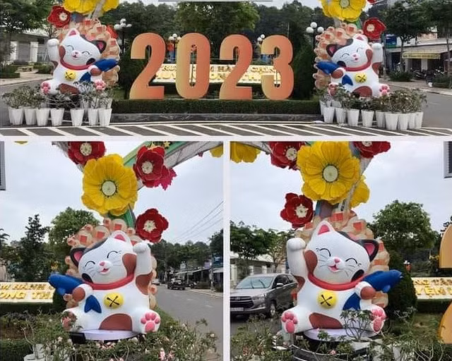 Hai chú mèo linh vật 2023 tại huyện Long Thành, tỉnh Đồng Nai có vẻ ngoài không quá cầu kỳ, nhưng vẫn toát lên vẻ dễ thương, xinh xắn. Đôi tay "măng cụt" đang vẫy chào và miệng cười chúm chím của chú mèo này thật ngộ nghĩnh, đáng yêu.