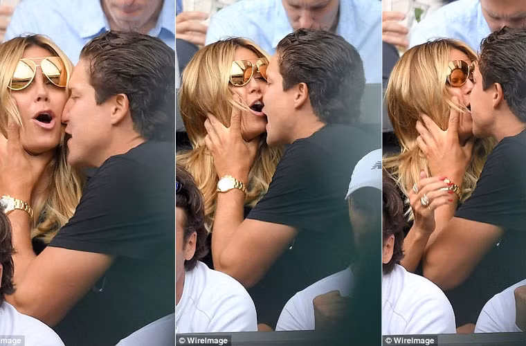 Cựu siêu mẫu Heidi Klum bị tình trẻ Vito Schnabel ôm chặt, hôn ngấu nghiến khi cả hai đang ngồi trên khán đài theo dõi trận thi đấu quần vợt Wimbledon.