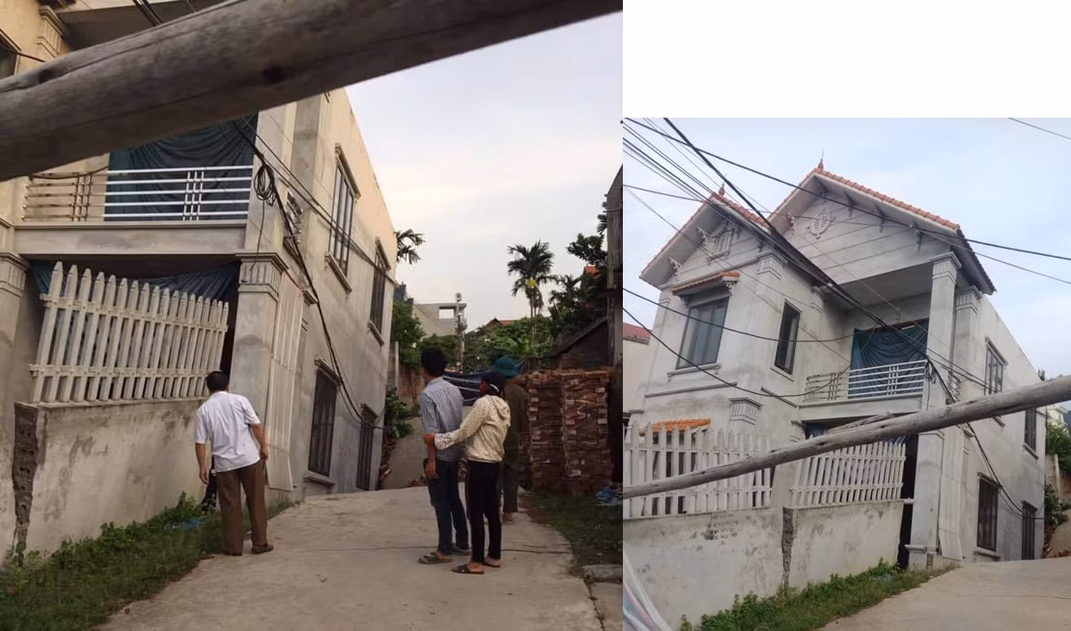 Ngôi nhà 2 tầng bị nghiêng do sụt đường.