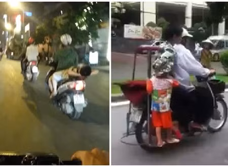 Ảnh cắt từ clip ghi lại cảnh đèo con vô cùng nguy hiểm của các phụ huynh Việt. Điều gì sẽ xảy ra nếu xe vô tình va chạm hoặc gặp chướng ngại vật?