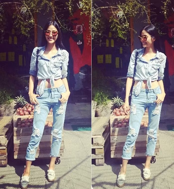 Ngoài cách kết hợp quần jeans với áo sơ mi trang nhã thì bạn có thể tạo nên cái nhìn cá tính, độc đáo. Cách lựa chọn áo sơ mi denim buộc vạt và quần jeans rách như Hoàng Thùy cũng là gợi ý cho cô nàng lăng xê vẻ ngoài phóng khoáng. Ảnh: Tiin.