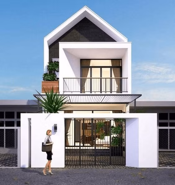 Mẫu nhà ống có sự kết hợp hoàn hảo của 2 gam màu lên ngôi 2021 là trắng và xám. Mặt tiền được xử lý khéo léo, tạo hiệu ứng sâu và rộng. Ảnh: Trananhgroup.
