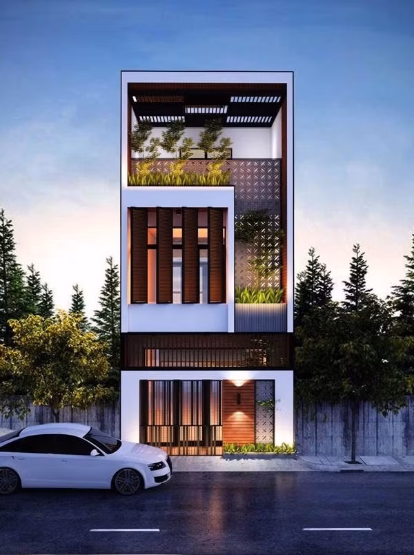 Nhà 3 tầng hình ống với thiết kế vườn treo dạng chữ L ngược thu hút gia chủ yêu thích sự phá cách. Ảnh: Internet.