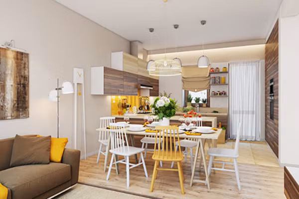 Sàn gỗ màu đậm như điểm đánh dấu sự chuyển đổi từ phòng khách được trải thảm đến phòng ăn tách biệt. Phòng ăn còn được tô điểm bằng những màu vàng bắt mắt tạo sự vui vẻ.