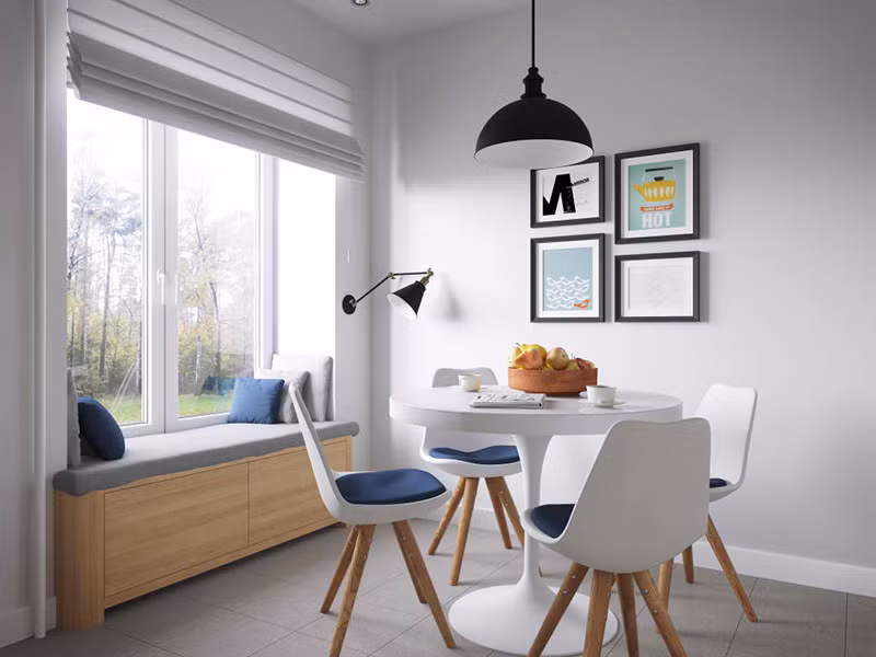 Khu vực ăn uống với màu trắng chủ đạo, khung cửa kính lớn mang ánh sáng đến khắp phòng, tạo cảm giác thoáng đãng, thư thái.