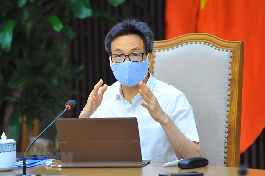  Phó Thủ tướng Chính phủ Vũ Đức Đam, Trưởng Ban Chỉ đạo Quốc gia phòng, chống dịch COVID-19 chủ trì cuộc họp. (Ảnh: Minh Đức/TTXVN)